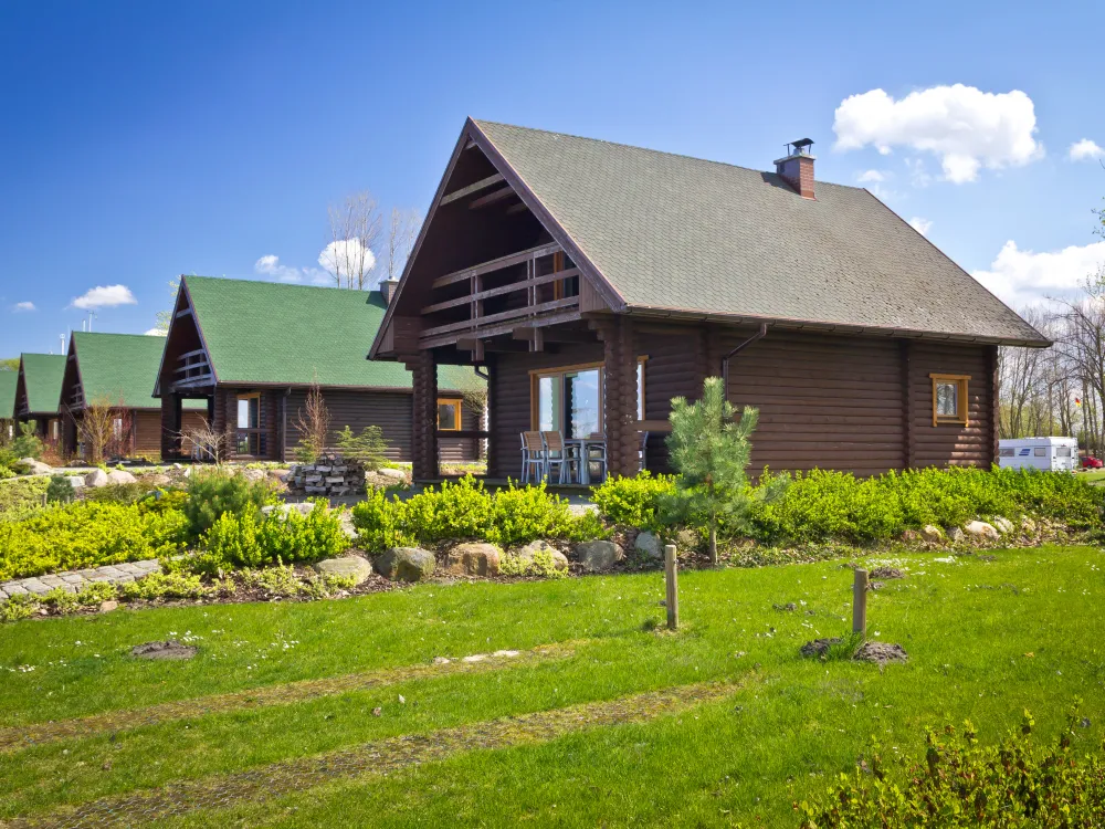 A row of log cabins.