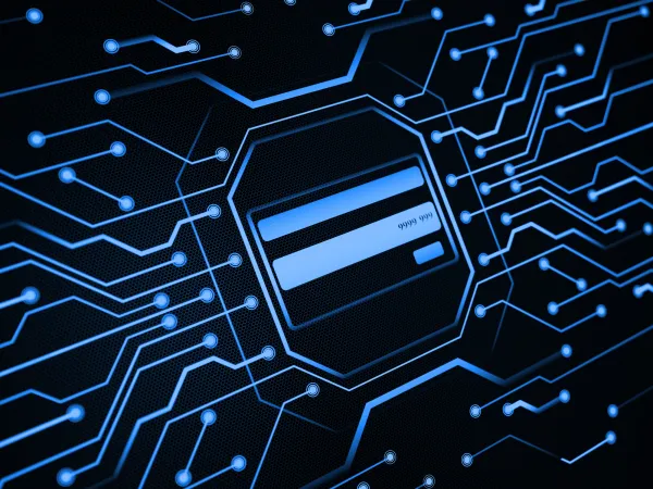 A digital credit card surrounded by a network of blue circuit lines on a dark background, symbolizing online transactions.