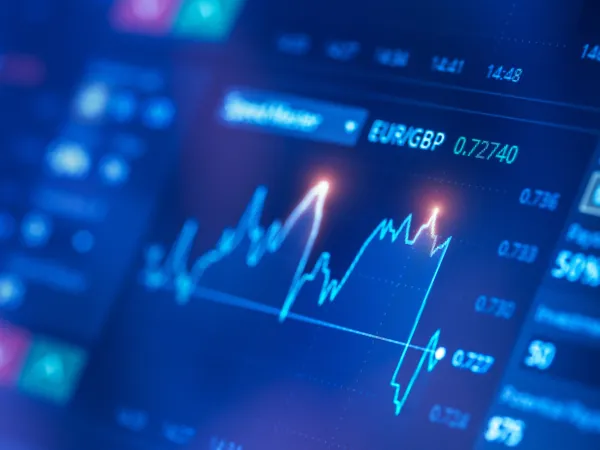 Close-up of a financial trading screen displaying the EUR/GBP currency pair with fluctuating line graph and market data.